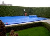 Copertura a pelo d'acqua, su misura per piscina interrata con sagomatura per trampolino - Anno 2010